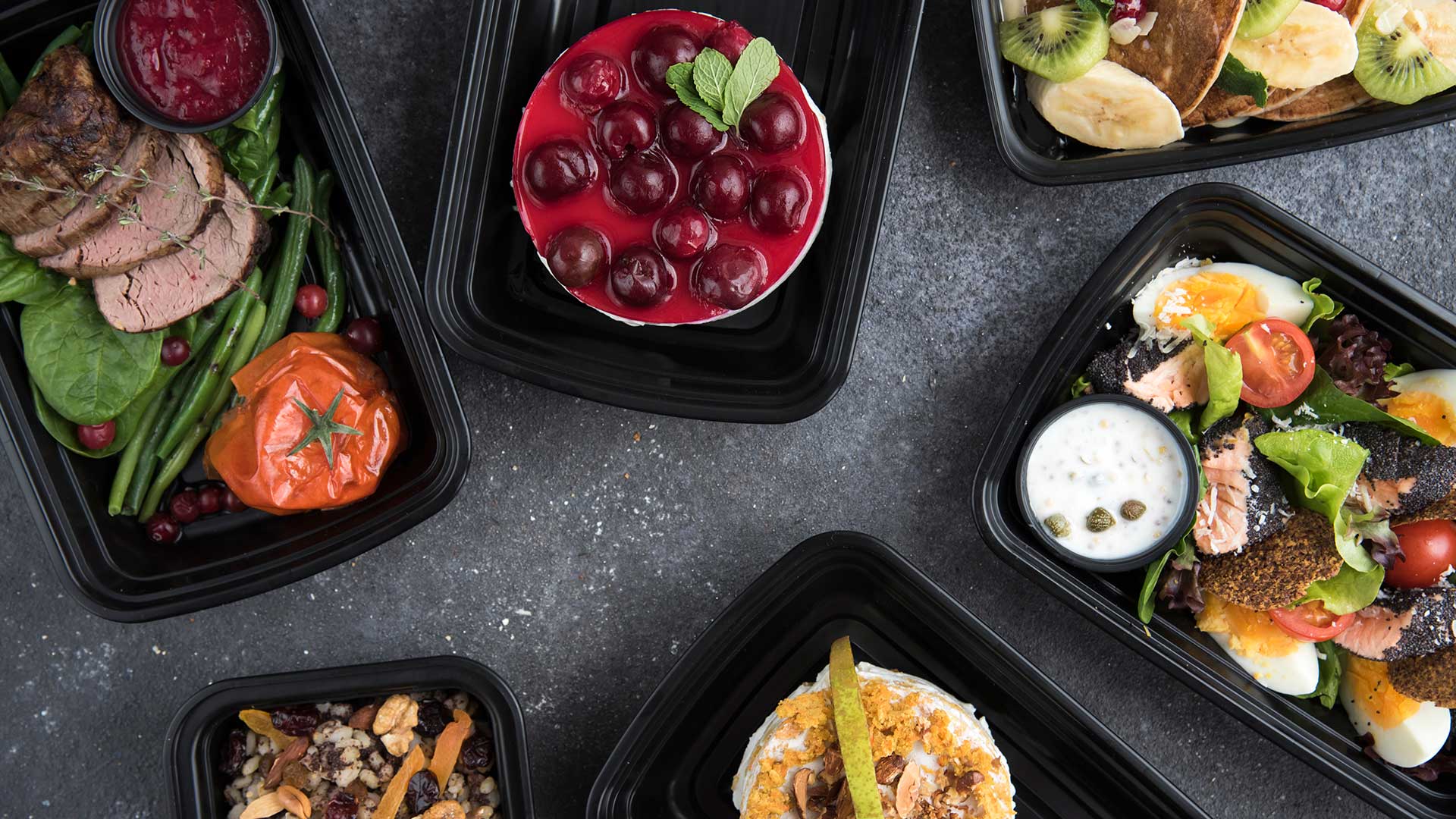 Healthy meal box on black top