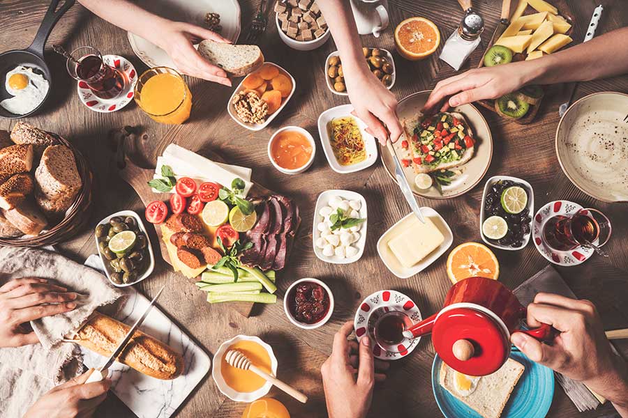 A top view of picture of people having Turkish Breakfast.