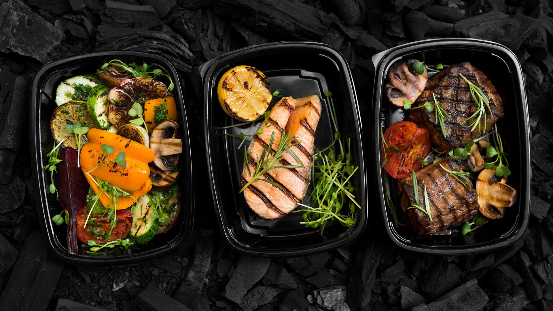 healthy meal box on charcoal