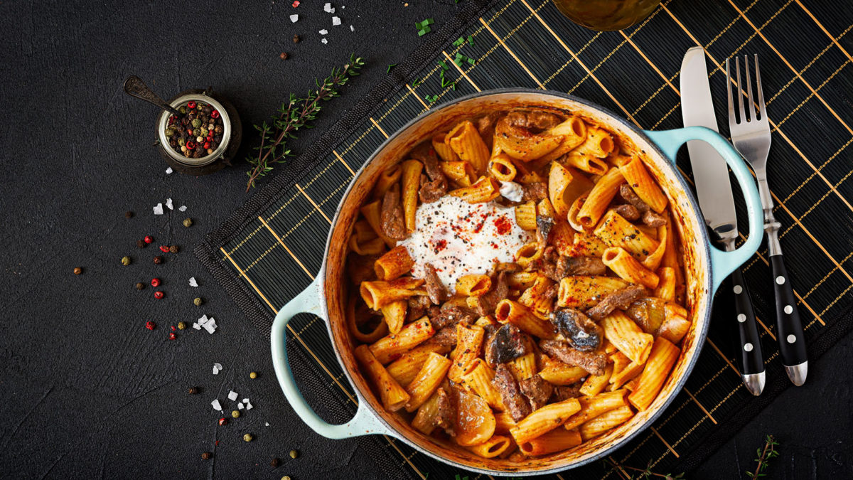 beef stroganoff on black countertop